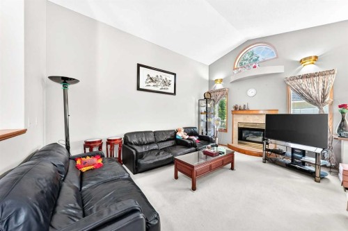 184 Hampshire Circle Nw, Calgary, AB - Indoor Photo Showing Living Room With Fireplace
