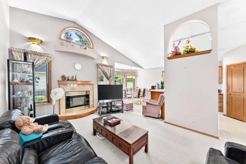 184 Hampshire Circle Nw, Calgary, AB - Indoor Photo Showing Living Room With Fireplace