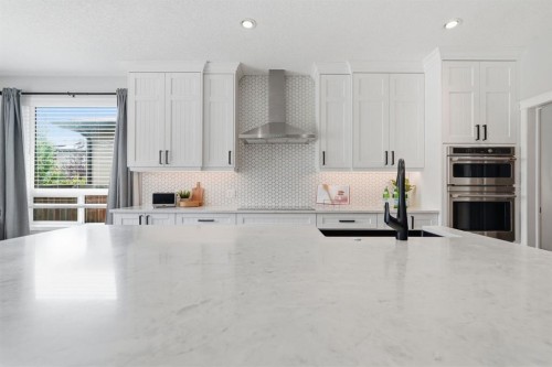 73 Morningside Circle, Airdrie, AB - Indoor Photo Showing Kitchen With Upgraded Kitchen