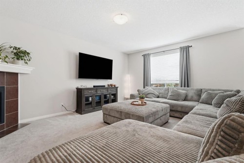 73 Morningside Circle, Airdrie, AB - Indoor Photo Showing Living Room With Fireplace