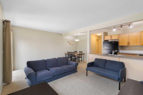 17 Panatella Villas Nw, Calgary, AB - Indoor Photo Showing Living Room