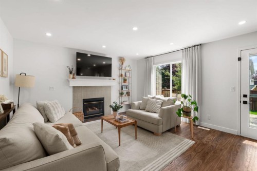 3725 Douglas Ridge Way Se, Calgary, AB - Indoor Photo Showing Living Room With Fireplace