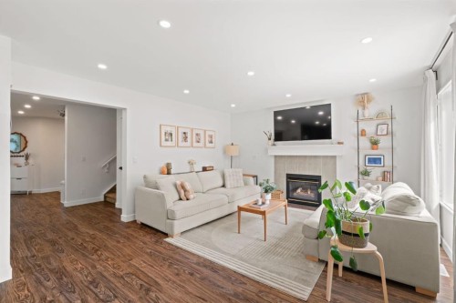 3725 Douglas Ridge Way Se, Calgary, AB - Indoor Photo Showing Living Room With Fireplace