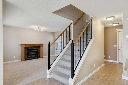 184 Cimarron Park Circle, Okotoks, AB - Indoor With Fireplace