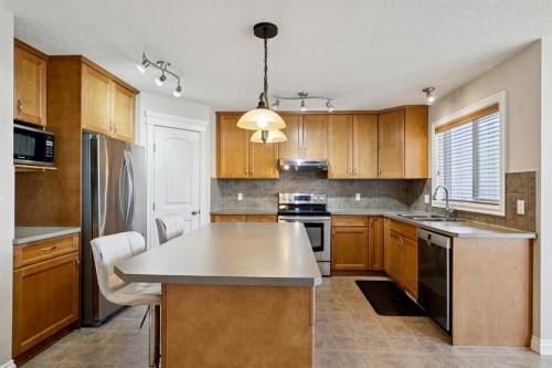 184 Cimarron Park Circle, Okotoks, AB - Indoor Photo Showing Kitchen With Double Sink