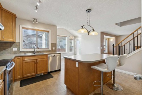 184 Cimarron Park Circle, Okotoks, AB - Indoor Photo Showing Kitchen With Double Sink