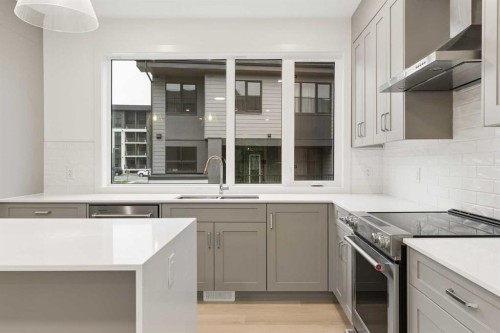 84-1453 Na'A Drive Sw, Calgary, AB - Indoor Photo Showing Kitchen With Double Sink