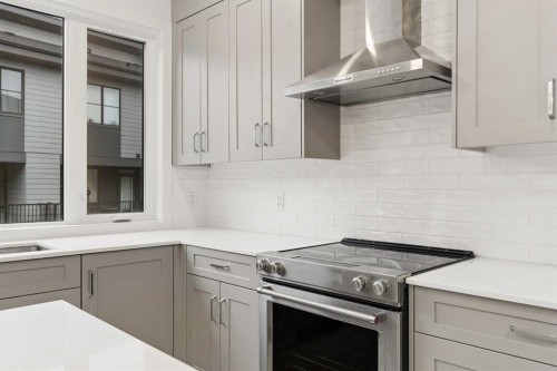 84-1453 Na'A Drive Sw, Calgary, AB - Indoor Photo Showing Kitchen With Upgraded Kitchen