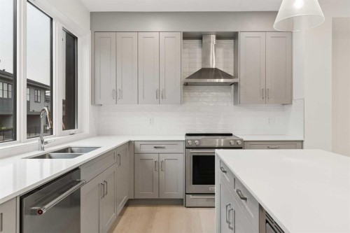 84-1453 Na'A Drive Sw, Calgary, AB - Indoor Photo Showing Kitchen With Double Sink With Upgraded Kitchen