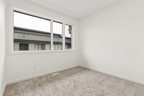 84-1453 Na'A Drive Sw, Calgary, AB - Indoor Photo Showing Other Room