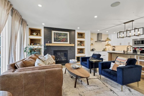 179 Capri Avenue Nw, Calgary, AB - Indoor Photo Showing Living Room With Fireplace