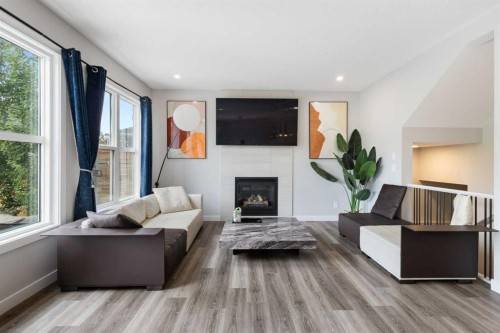 100 Crestbrook View Sw, Calgary, AB - Indoor Photo Showing Living Room With Fireplace