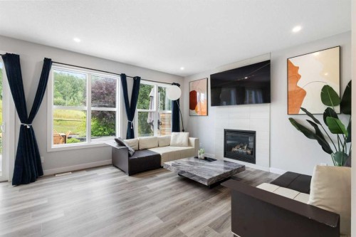 100 Crestbrook View Sw, Calgary, AB - Indoor Photo Showing Living Room With Fireplace