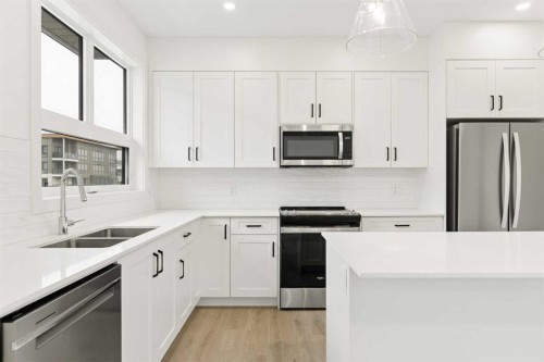 1475 Na'A Drive Sw, Calgary, AB - Indoor Photo Showing Kitchen With Double Sink With Upgraded Kitchen
