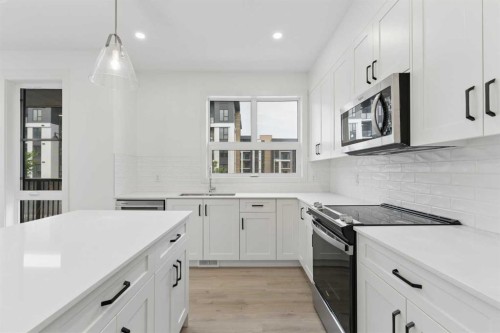 1475 Na'A Drive Sw, Calgary, AB - Indoor Photo Showing Kitchen With Upgraded Kitchen