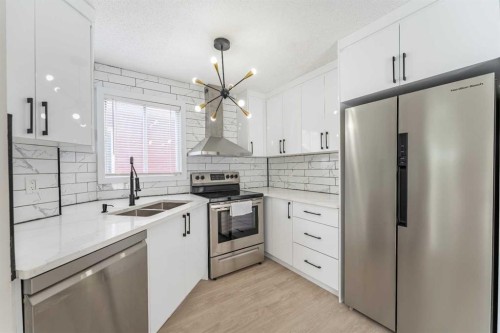 18 Falmere Way Ne, Calgary, AB - Indoor Photo Showing Kitchen With Stainless Steel Kitchen With Double Sink With Upgraded Kitchen