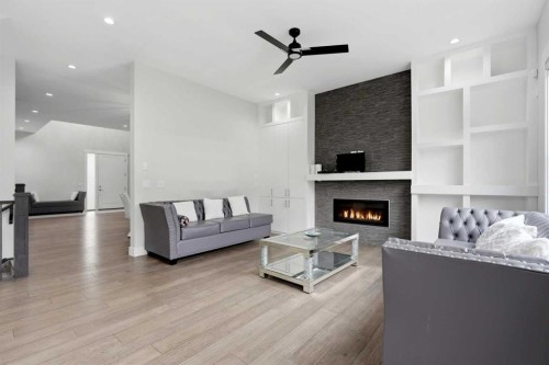 111 Kinniburgh Place, Chestermere, AB - Indoor Photo Showing Other Room With Fireplace