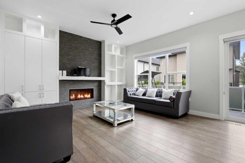 111 Kinniburgh Place, Chestermere, AB - Indoor Photo Showing Living Room With Fireplace