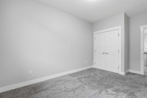 111 Kinniburgh Place, Chestermere, AB - Indoor Photo Showing Other Room