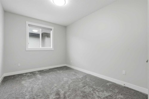 111 Kinniburgh Place, Chestermere, AB - Indoor Photo Showing Other Room