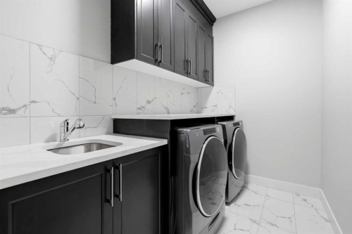 111 Kinniburgh Place, Chestermere, AB - Indoor Photo Showing Laundry Room