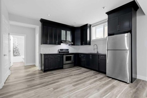 111 Kinniburgh Place, Chestermere, AB - Indoor Photo Showing Kitchen With Stainless Steel Kitchen With Upgraded Kitchen