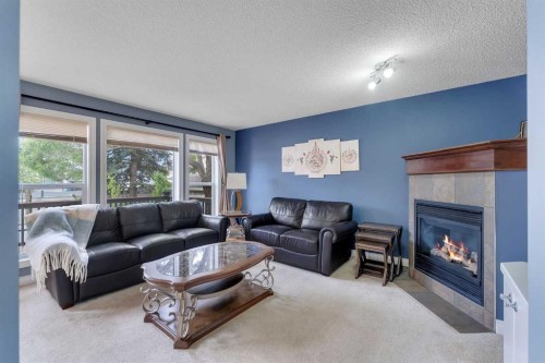169 West Creek Boulevard, Chestermere, AB - Indoor Photo Showing Living Room With Fireplace