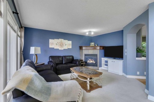 169 West Creek Boulevard, Chestermere, AB - Indoor Photo Showing Living Room With Fireplace