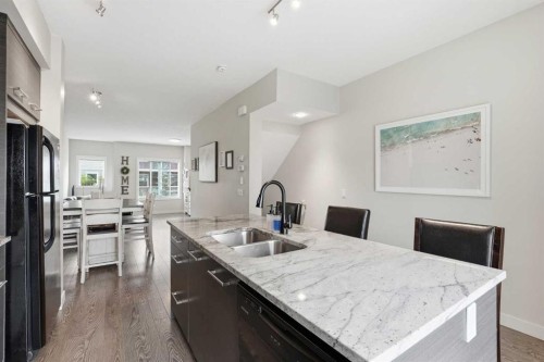 17 Stonehouse Crescent Nw, High River, AB - Indoor Photo Showing Kitchen With Double Sink