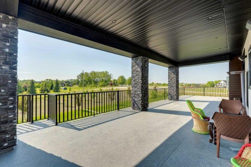 48017 Harvest Lane East, Rural Foothills County, AB - Outdoor With Deck Patio Veranda With Exterior