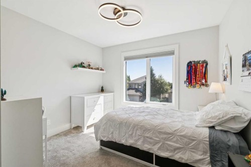 22 Patrick View Sw, Calgary, AB - Indoor Photo Showing Bedroom