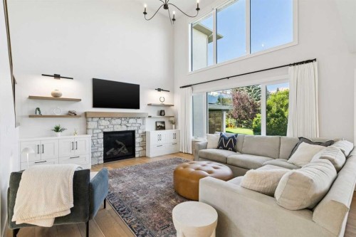 22 Patrick View Sw, Calgary, AB - Indoor Photo Showing Living Room With Fireplace