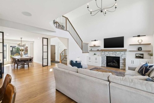 22 Patrick View Sw, Calgary, AB - Indoor Photo Showing Living Room With Fireplace