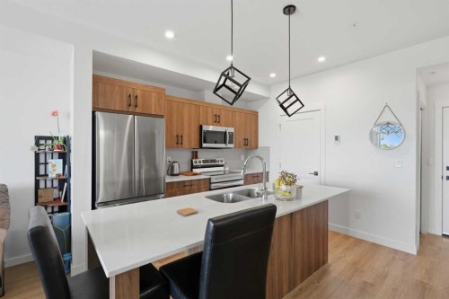 5112-200 Seton Circle Se, Calgary, AB - Indoor Photo Showing Kitchen With Stainless Steel Kitchen With Double Sink