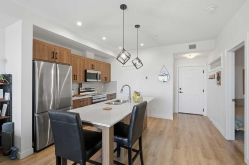 5112-200 Seton Circle Se, Calgary, AB - Indoor Photo Showing Kitchen With Stainless Steel Kitchen With Double Sink With Upgraded Kitchen