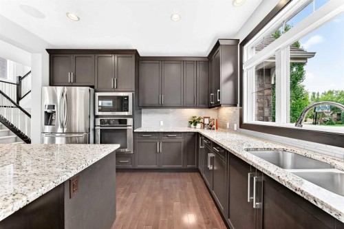 96 Cranarch Heights Se, Calgary, AB - Indoor Photo Showing Kitchen With Stainless Steel Kitchen With Double Sink With Upgraded Kitchen