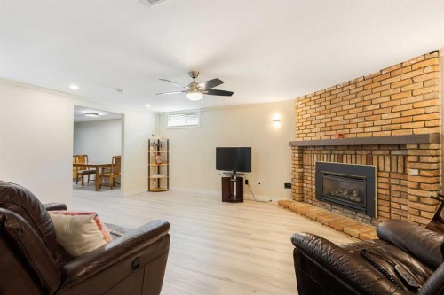 14904 1 Street Se, Calgary, AB - Indoor Photo Showing Living Room With Fireplace