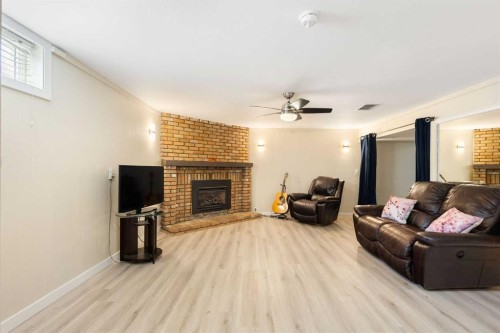 14904 1 Street Se, Calgary, AB - Indoor Photo Showing Living Room With Fireplace