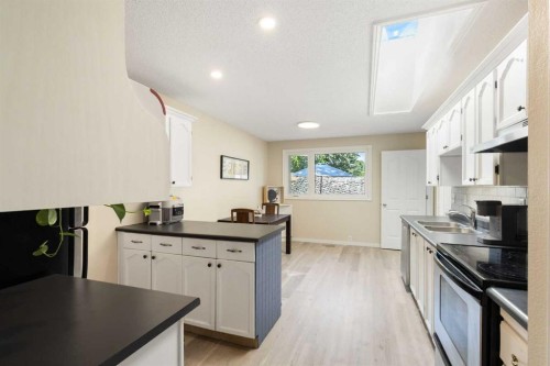 14904 1 Street Se, Calgary, AB - Indoor Photo Showing Kitchen With Double Sink