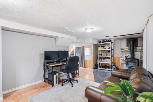 2145 24 Avenue, Didsbury, AB - Indoor With Fireplace