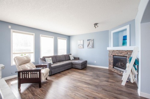 443 Tuscany Ridge Heights Nw, Calgary, AB - Indoor Photo Showing Living Room With Fireplace