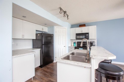 443 Tuscany Ridge Heights Nw, Calgary, AB - Indoor Photo Showing Kitchen With Double Sink