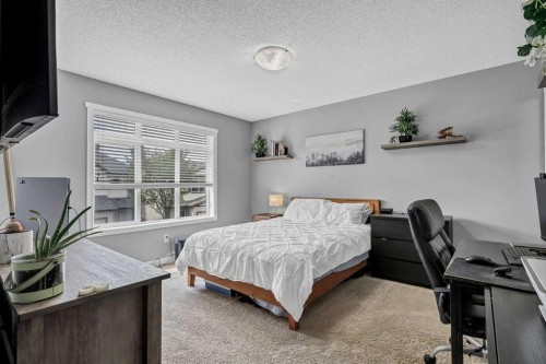 72 Copperpond Landing Se, Calgary, AB - Indoor Photo Showing Bedroom