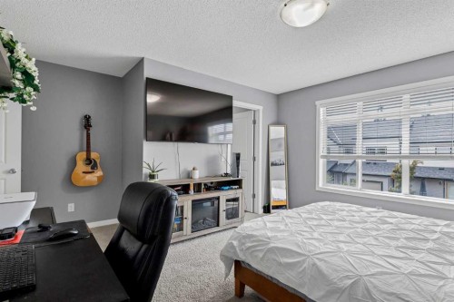 72 Copperpond Landing Se, Calgary, AB - Indoor Photo Showing Bedroom