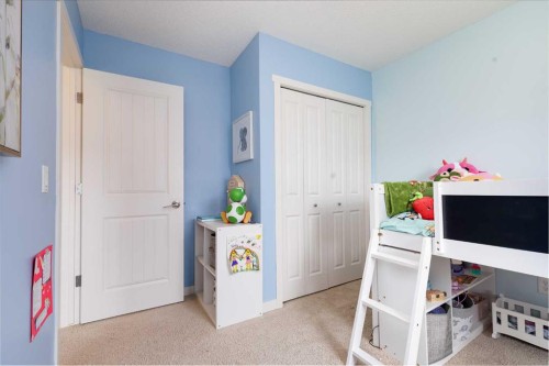 72 Copperpond Landing Se, Calgary, AB - Indoor Photo Showing Bedroom