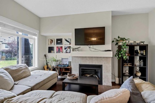 72 Copperpond Landing Se, Calgary, AB - Indoor Photo Showing Living Room With Fireplace