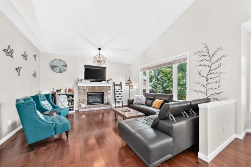 152 Chaparral Drive Se, Calgary, AB - Indoor Photo Showing Living Room With Fireplace