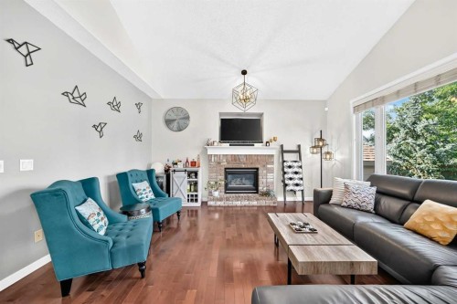 152 Chaparral Drive Se, Calgary, AB - Indoor Photo Showing Living Room With Fireplace