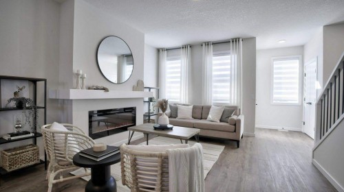 367 Wolf River Drive Se, Calgary, AB - Indoor Photo Showing Living Room With Fireplace