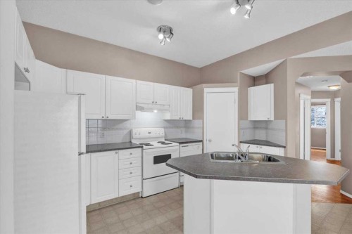 231 Tuscany Drive Nw, Calgary, AB - Indoor Photo Showing Kitchen With Double Sink